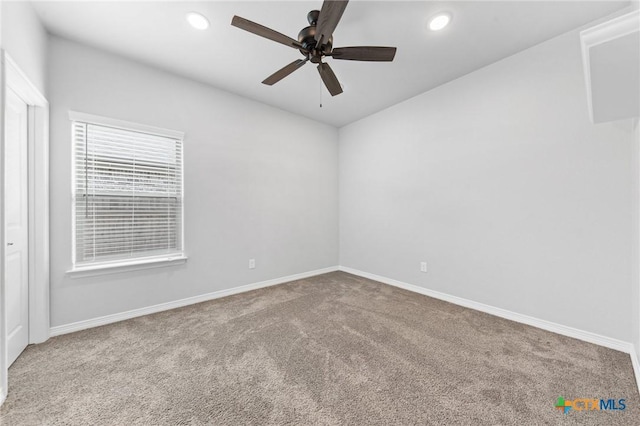 carpeted empty room with ceiling fan