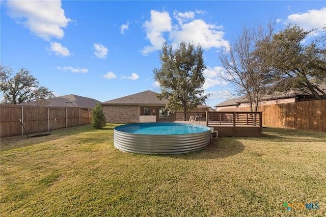 view of yard featuring a swimming pool side deck