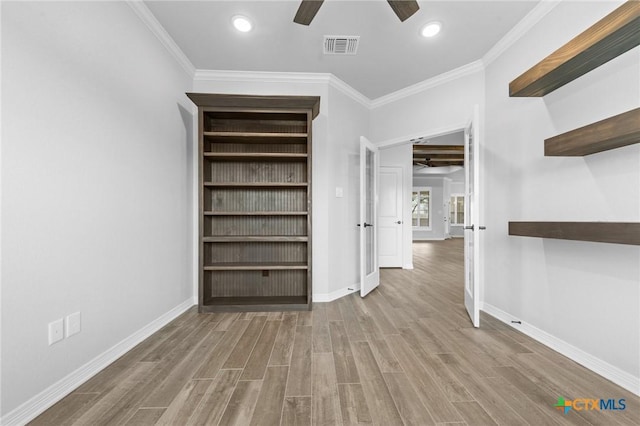 interior space featuring light hardwood / wood-style floors and ornamental molding