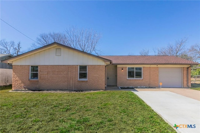 ranch-style house with a front lawn, brick siding, driveway, and an attached garage