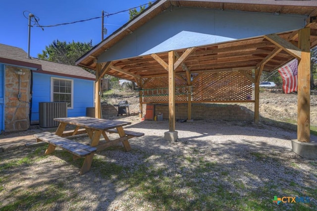 view of patio with a grill and central AC unit