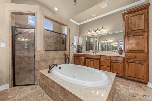 bathroom featuring vanity, ornamental molding, and separate shower and tub