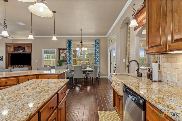 kitchen with dark wood-type flooring, dishwasher, a chandelier, ornamental molding, and decorative light fixtures