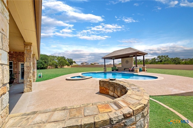 view of swimming pool featuring a lawn, an in ground hot tub, a gazebo, and a patio area