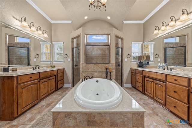 bathroom featuring independent shower and bath, plenty of natural light, and ornamental molding