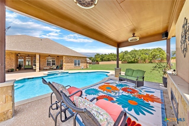 view of pool with a yard and a patio area