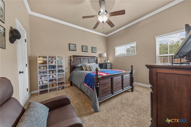 carpeted bedroom featuring ornamental molding and ceiling fan