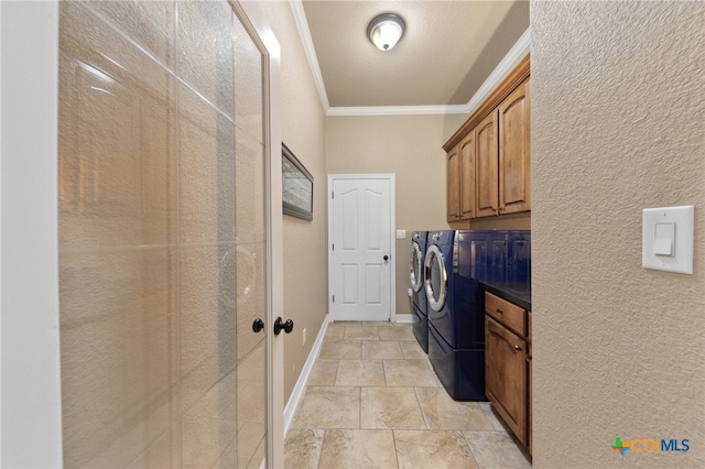 laundry room with washer and clothes dryer, cabinets, and ornamental molding