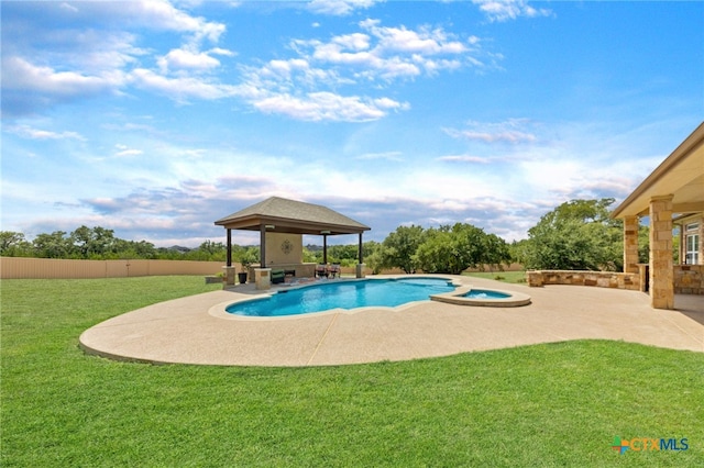 view of pool with a patio, a yard, an in ground hot tub, and a gazebo