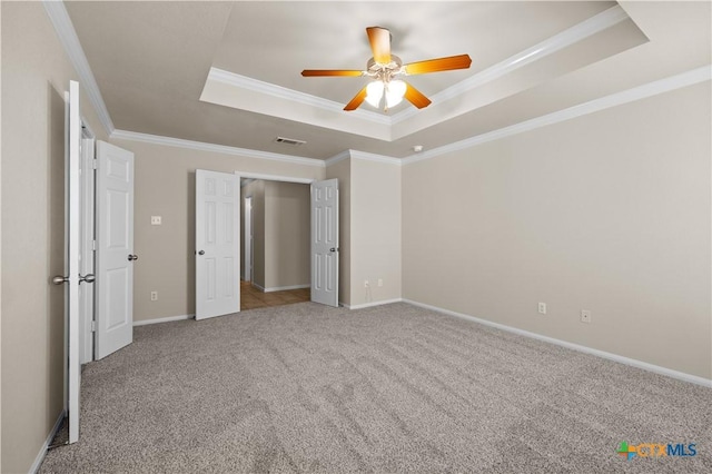901 Mustang Trl, Harker Heights, TX 76548 - unfurnished bedroom featuring a raised ceiling, carpet flooring, crown molding, and ceiling fan