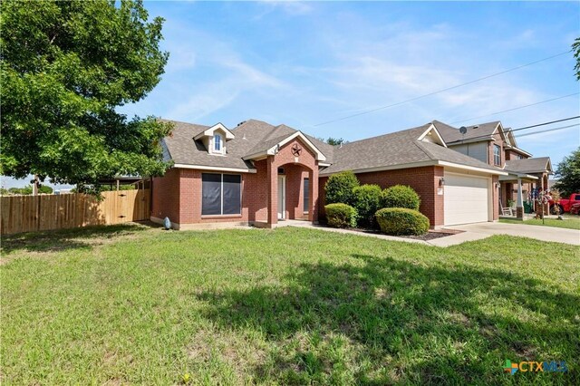 901 Mustang Trl, Harker Heights, TX 76548 - traditional-style house featuring brick siding, an attached garage, driveway, and a shingled roof