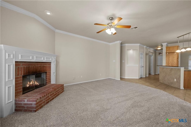 901 Mustang Trl, Harker Heights, TX 76548 - unfurnished living room with light carpet, a ceiling fan, crown molding, a brick fireplace, and light tile patterned floors