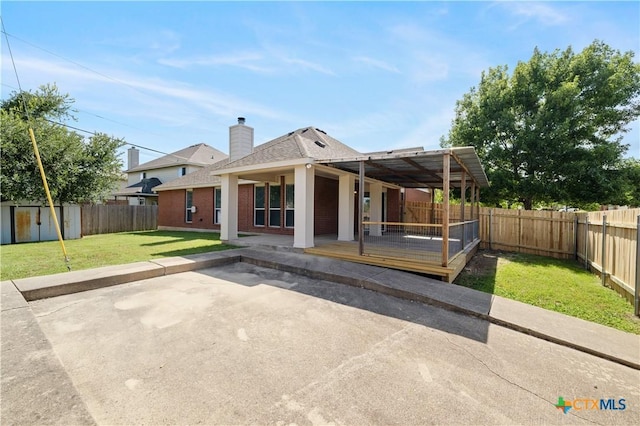 901 Mustang Trl, Harker Heights, TX 76548 - view of front of property featuring a patio area, a fenced backyard, a shingled roof, and a chimney