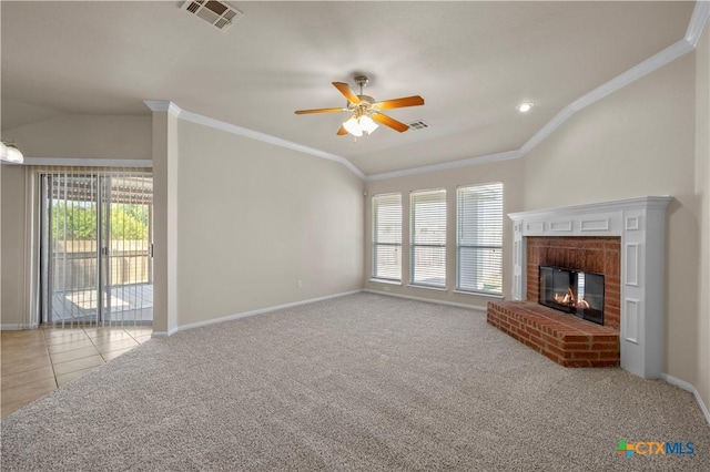901 Mustang Trl, Harker Heights, TX 76548 - unfurnished living room featuring healthy amount of natural light, ornamental molding, ceiling fan, vaulted ceiling, and a fireplace