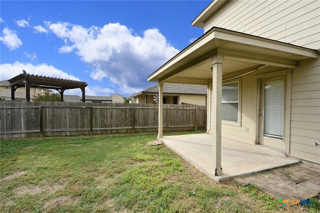 view of yard with a pergola and a patio