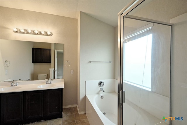 full bathroom with vanity, independent shower and bath, tile patterned floors, and toilet