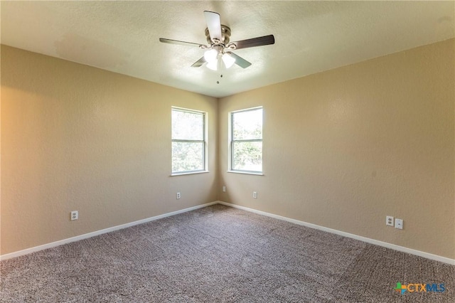 unfurnished room with carpet flooring and ceiling fan