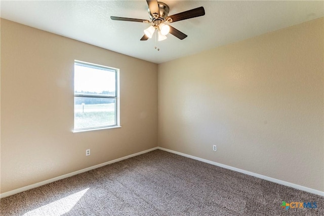 spare room with ceiling fan and carpet floors