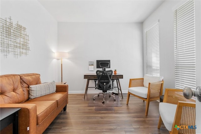 office featuring baseboards and wood finished floors