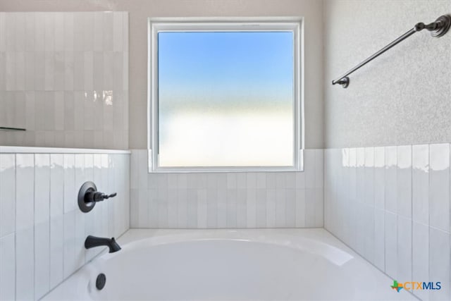 bathroom with a washtub