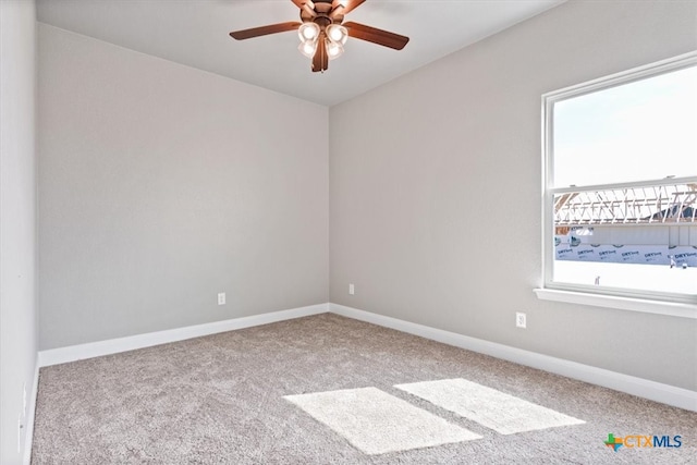 carpeted empty room featuring ceiling fan