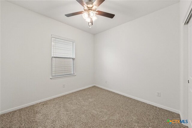 spare room with ceiling fan and carpet flooring