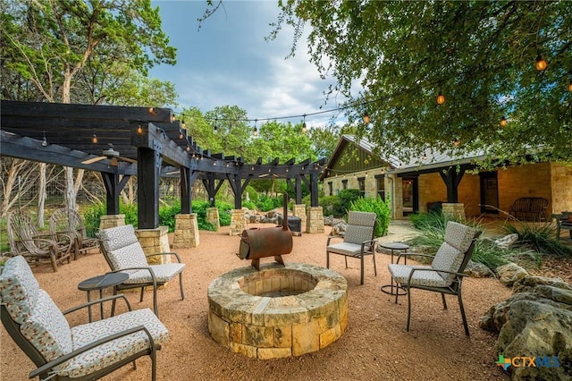 view of patio / terrace featuring a pergola and an outdoor fire pit