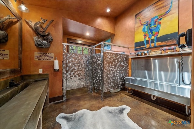 bathroom featuring concrete floors