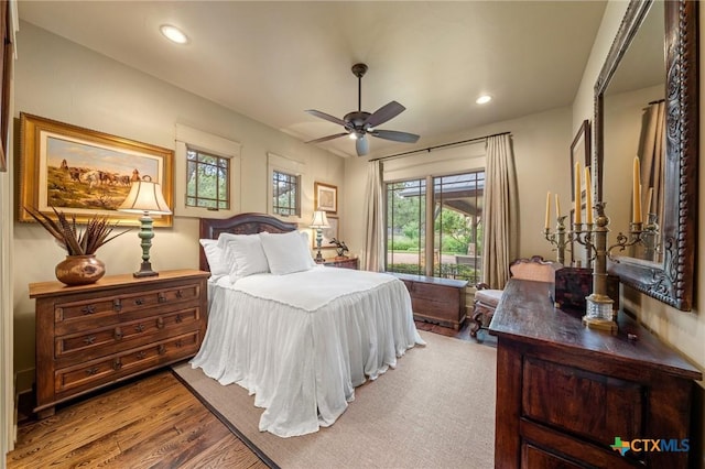 bedroom with ceiling fan and hardwood / wood-style flooring