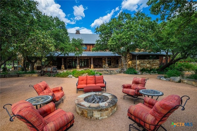 view of patio with a fire pit