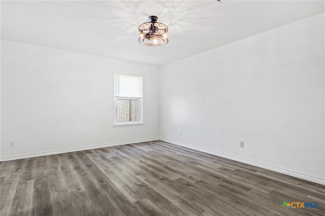 empty room featuring dark hardwood / wood-style flooring