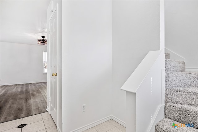 stairs with wood-type flooring