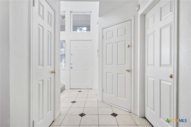 view of tiled foyer entrance