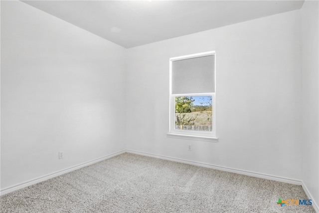 unfurnished room with carpet flooring