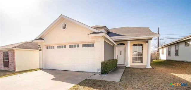 2705 Haven Dr, Killeen, TX 76543 - view of front of home featuring a garage, concrete driveway, and stucco siding