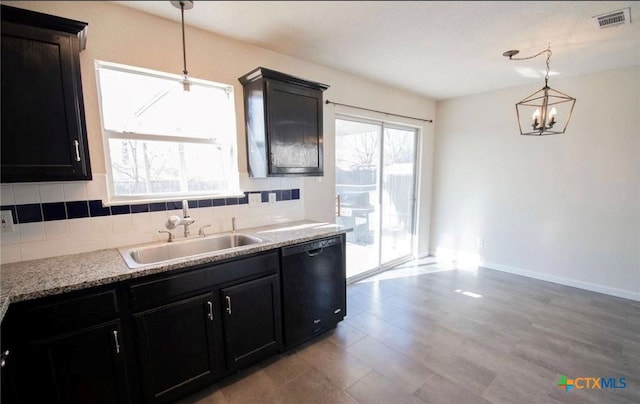 2705 Haven Dr, Killeen, TX 76543 - kitchen featuring dishwasher, decorative backsplash, a chandelier, and hanging light fixtures