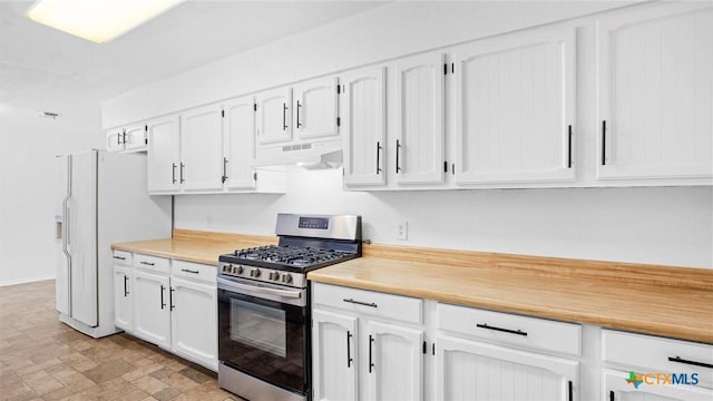 218 Gruene Rd, New Braunfels, TX 78130 - kitchen with gas range, under cabinet range hood, white cabinetry, and light countertops