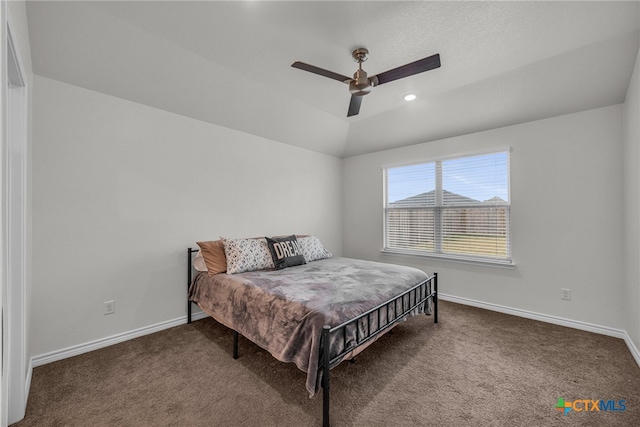 bedroom featuring vaulted ceiling, ceiling fan, and carpet floors