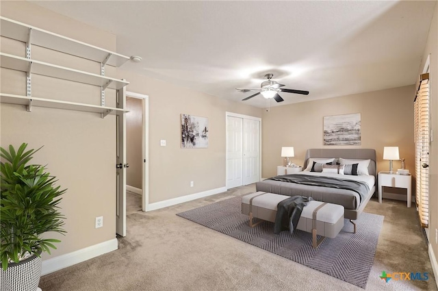 carpeted bedroom with baseboards, ceiling fan, and a closet