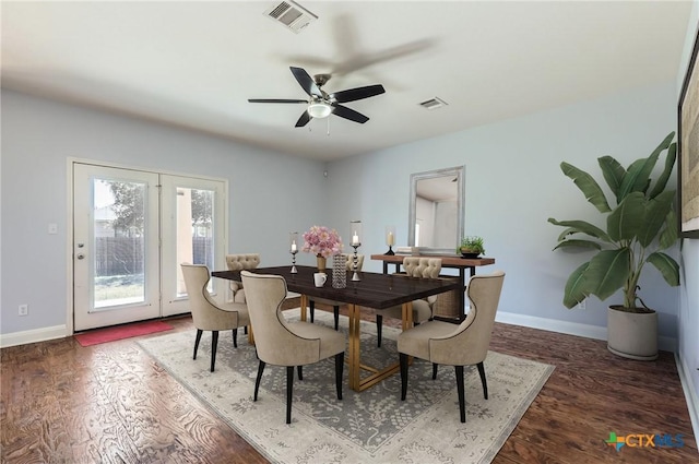 dining area with visible vents, baseboards, and wood finished floors