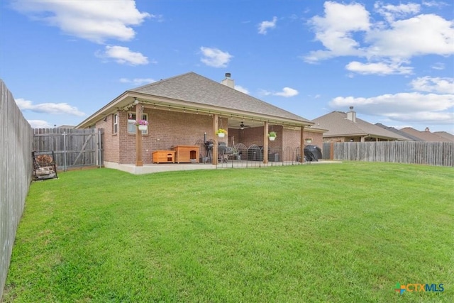 603 Willow Dr, Troy, TX 76579 - back of house featuring brick siding, a patio, a ceiling fan, a chimney, and roof with shingles