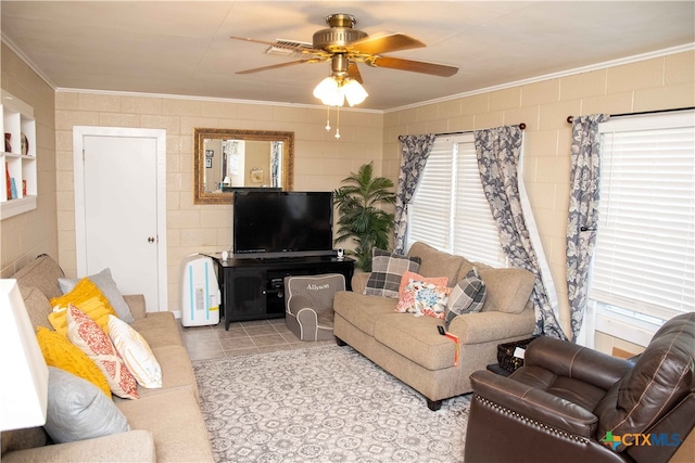 living room with ceiling fan, ornamental molding, and light tile patterned floors