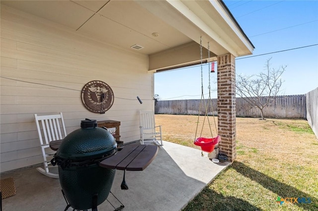 view of patio featuring visible vents and a fenced backyard