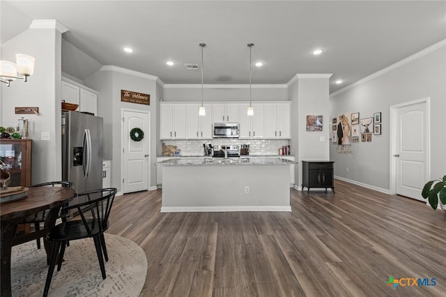 kitchen with dark wood finished floors, white cabinets, visible vents, and appliances with stainless steel finishes