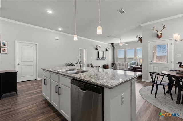 kitchen with a sink, visible vents, dishwasher, and crown molding