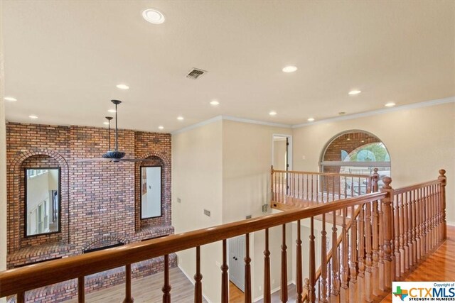 6503 Wells Fargo Rd, Killeen, TX 76542 - hall featuring an upstairs landing, recessed lighting, light wood-style floors, baseboards, and crown molding