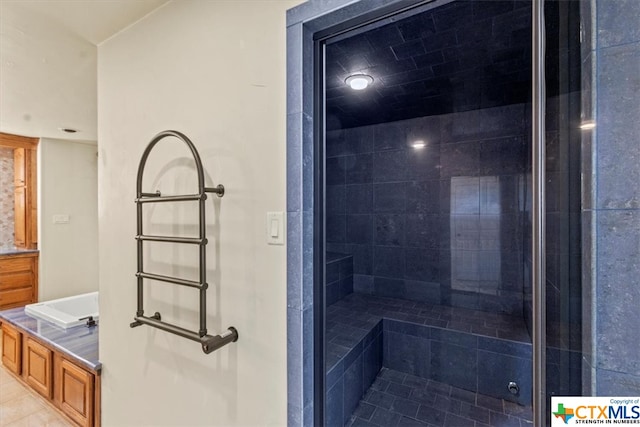 bathroom featuring tile patterned flooring and separate shower and tub