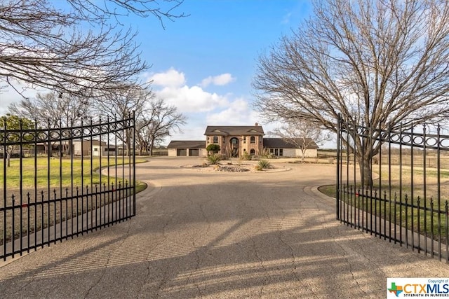 6503 Wells Fargo Rd, Killeen, TX 76542 - view of asphalt driveway featuring a gate