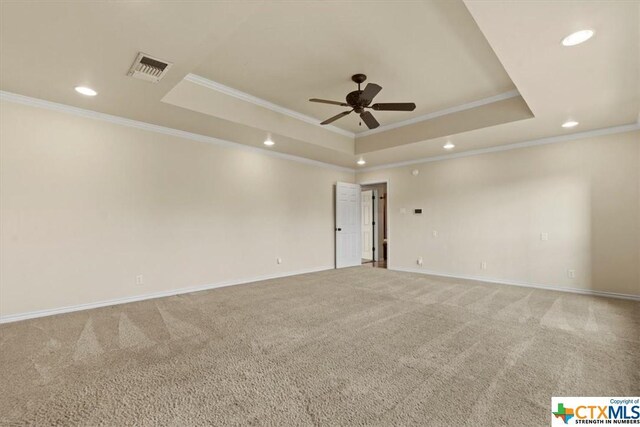 6503 Wells Fargo Rd, Killeen, TX 76542 - carpeted spare room featuring crown molding, a tray ceiling, recessed lighting, a ceiling fan, and baseboards