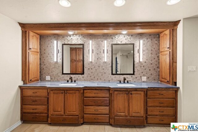 6503 Wells Fargo Rd, Killeen, TX 76542 - bathroom featuring tile patterned flooring, double vanity, and baseboards